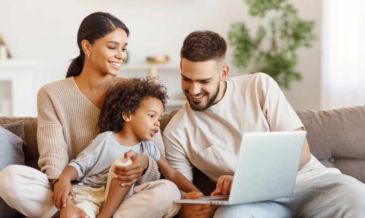 family using a laptop